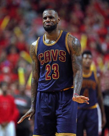 LeBron cracks after hearing LeChoker Shames for the one millionth time. (Jonathan Daniel/Getty Images)