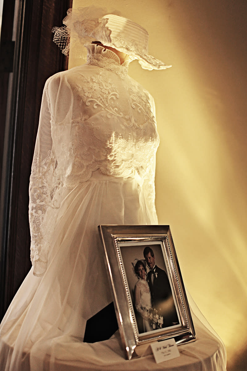 This undated photo provided by Moxie Photography shows a display of vintage wedding dresses belonging to members of the family, that one couple displayed at their wedding reception. Personalizing the décor is a popular trend in wedding receptions, and there are many creative, inexpensive ideas to be found on the Internet’s bridal sites and pin boards. (AP Photo/Moxie Photography, Diana Vermeulen)