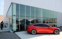 FILE PHOTO - A prototype of the Tesla Model 3 is on display in front of the factory during a media tour of the Tesla Gigafactory which will produce batteries for the electric carmaker in Sparks, Nevada, U.S. July 26, 2016. REUTERS/James Glover II/File Photo