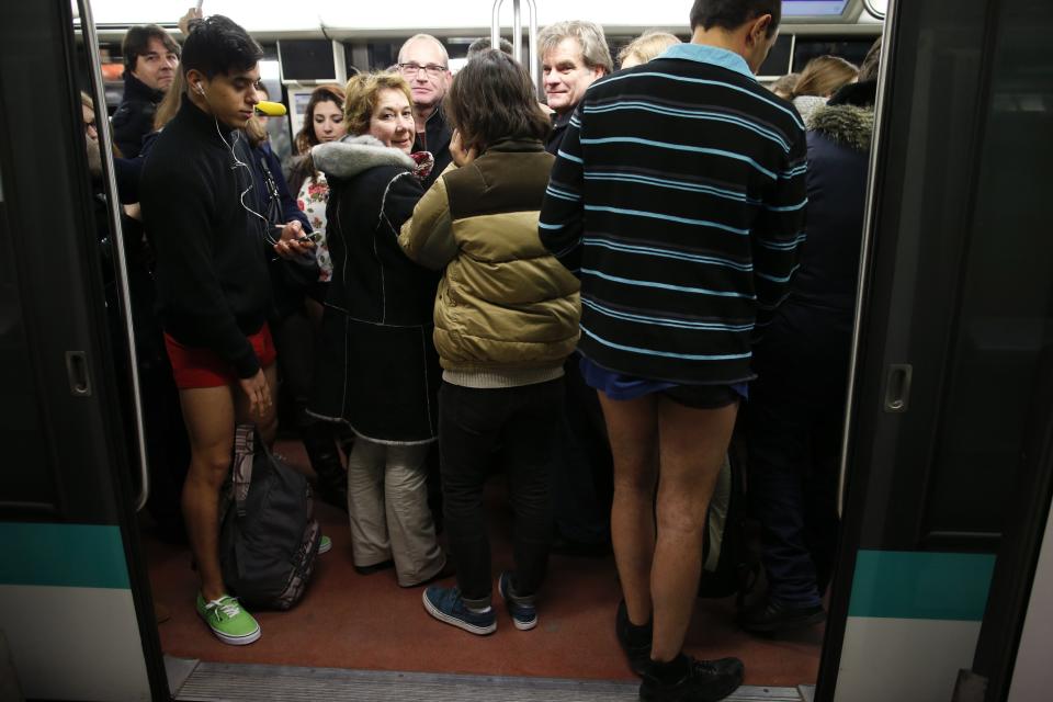 Passengers without their pants ride a subway train during the "No Pants Subway Ride" in Paris