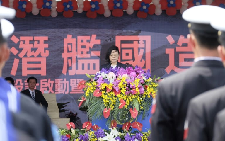 President Tsai Ing-wen stands in front of a slogan calling for Taiwan to build its own submarines, at a navy base in the island's south