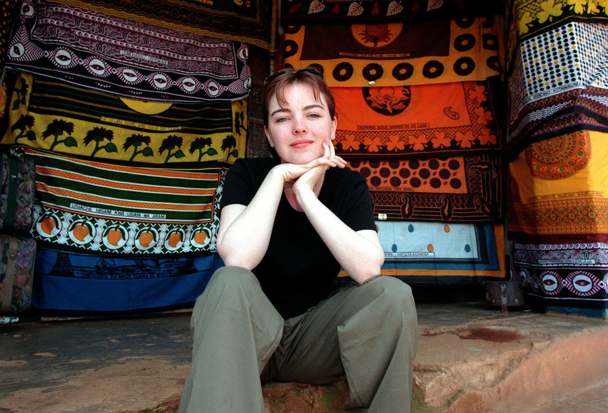 Melanie Clark Pullen (Mary in 'Eastenders') on a Christian Aid trip to Tanzania in East Africa, to highlight the Jubilee 2000 campaign to cancel Third World debt. Here Melanie rests on the steps outside a shop in Njombe, where she purchased a kanga (local dress).   (Photo by Peter Jordan - PA Images/PA Images via Getty Images)