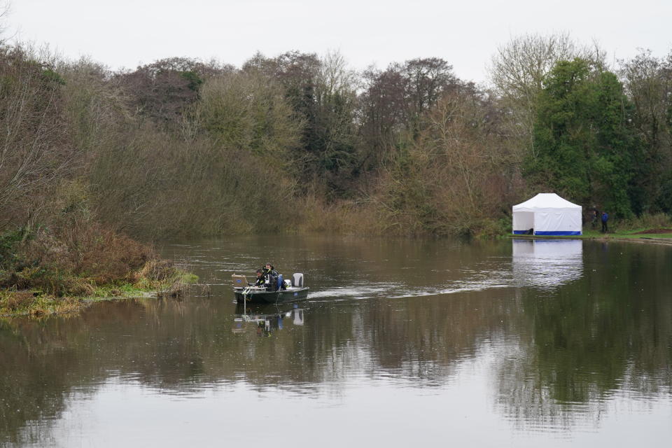 Police search teams on the River Wensum in Wensum Park, Norwich, on Friday. (PA)