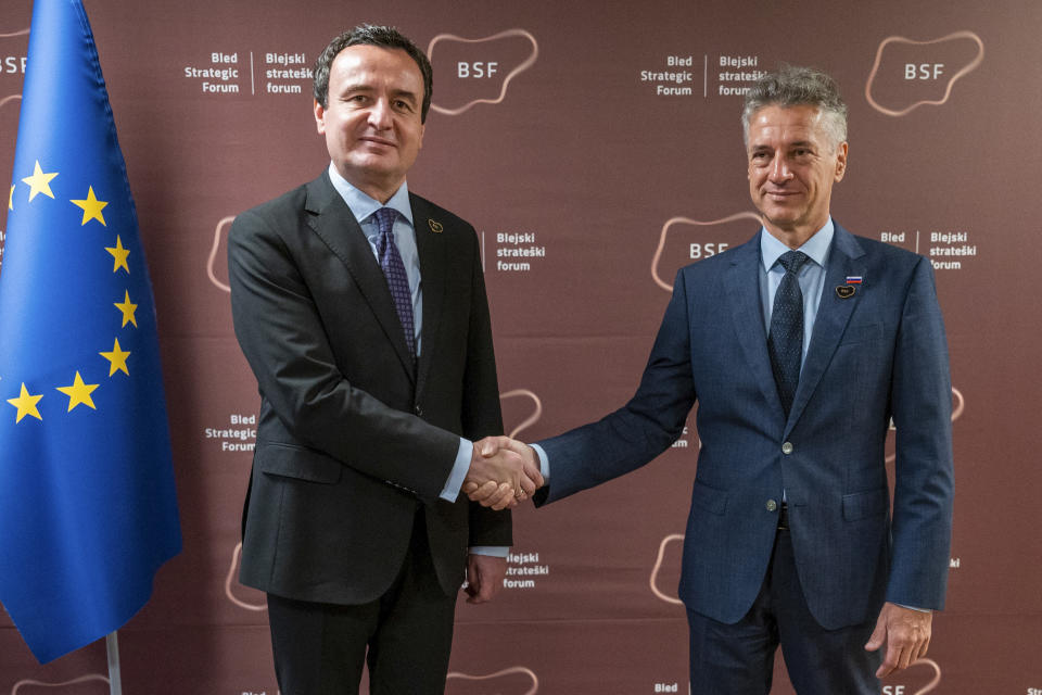 In this photo provided by the Slovenian Government, Slovenia's Prime Minister Robert Golob, right, shakes hands with Kosovo Prime Minister Albin Kurti during the Bled Strategic Forum 2023 at the Bled Festival Hall in Bled, Slovenia, Monday, Aug. 28, 2023. (Bostjan Podlogar/Slovenian Government Press Service via AP)