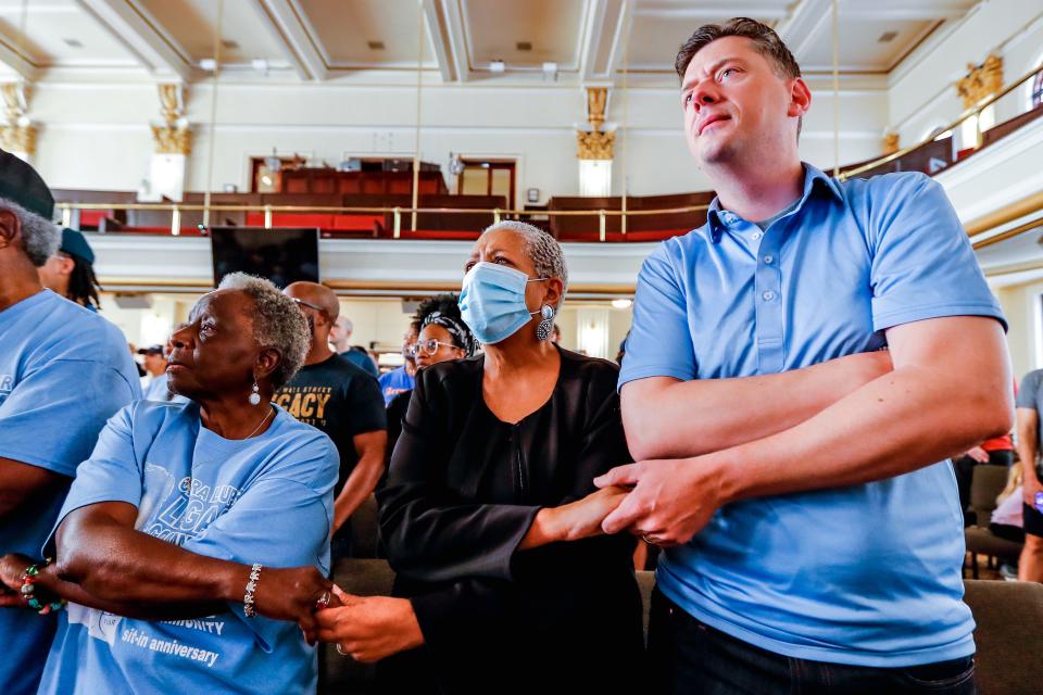 Oklahoma City Mayor David Holt holds hands with participants Saturday during a reenactment of the sit-in on Aug. 19, 1958, at Katz Drug Store. The reenactment was held at Kaiser's Grateful Bean to commemorate the 65th anniversary of the Oklahoma City civil rights movement.