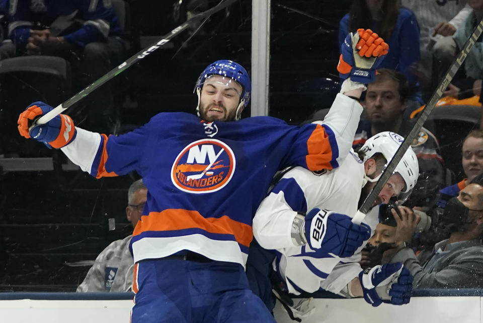 New York Islanders defenseman Adam Pelech (3) collides with Tampa Bay Lightning right wing Nikita Kucherov (86) during the first period of Game 3 of the NHL hockey Stanley Cup semifinals, Thursday, June 17, 2021, in Uniondale, N.Y. (AP Photo/Frank Franklin II)