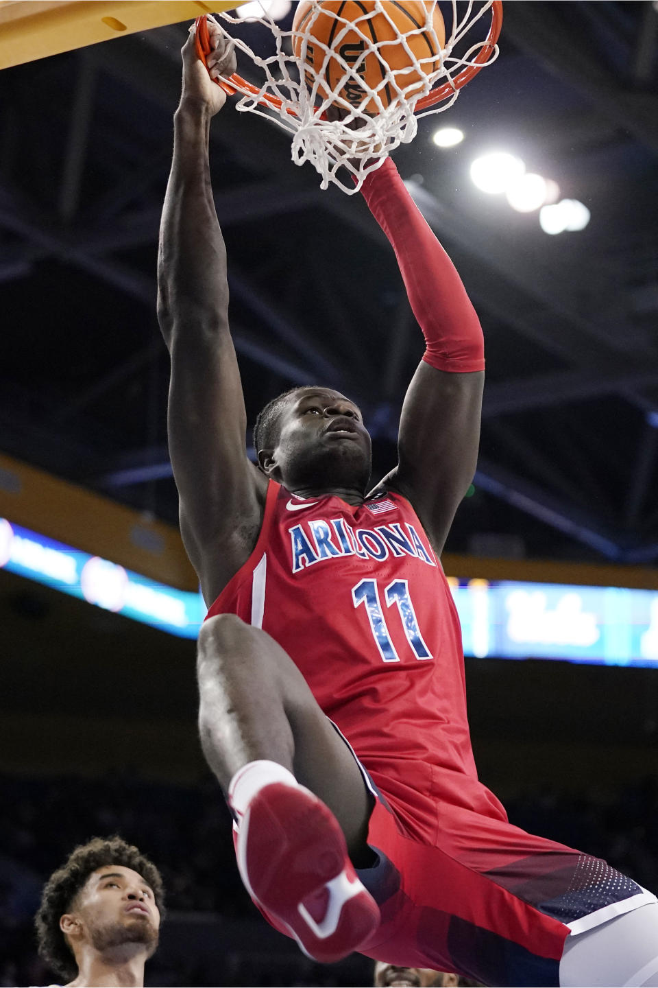 Arizona center Oumar Ballo dunks during the first half of an NCAA college basketball game against UCLA Tuesday, Jan. 25, 2022, in Los Angeles. (AP Photo/Mark J. Terrill)