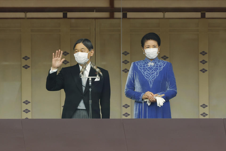 Japan's Emperor Naruhito, with Empress Masako, waves to audience members during his birthday celebration at the Imperial Palace in Tokyo, Thursday, Feb. 23, 2023. (Rodrigo Reyes Marin/Pool Photo via AP)