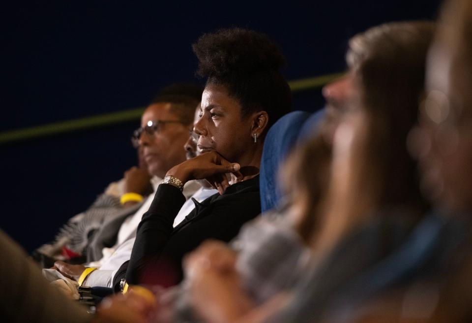Members of the audience listen during an Emmett Till panel discussion Sunday following the screening of the movie "Till" at the AMC Bayou 15 theater in Pensacola.