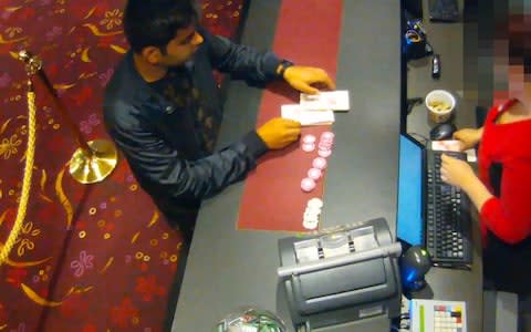 CCTV captured Qaiser cashing in some of his money at a casino - Credit: Universal News