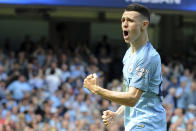 Manchester City's Phill Foden celebrates his goal against Tottenham during the English Premier League soccer match between Manchester City and Tottenham Hotspur at Etihad stadium in Manchester, England, Saturday, April 20, 2019. (AP Photo/Rui Vieira)