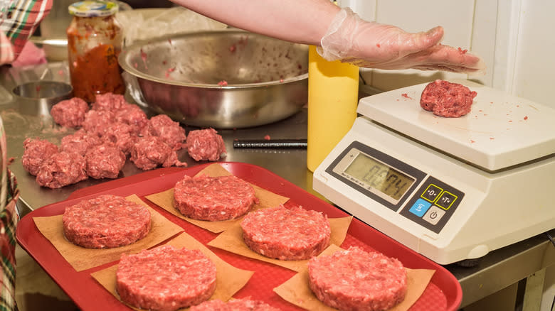 Ground beef patties weighed on scale