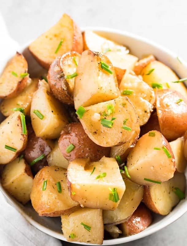 <p>The Salty Marshmallow</p><p>These crock pot roasted potatoes are bursting with garlic and ranch flavor!</p><p><strong>Get the recipe: <a href="https://thesaltymarshmallow.com/crockpot-garlic-ranch-red-potatoes/" rel="nofollow noopener" target="_blank" data-ylk="slk:Crock Pot Garlic Ranch Red Potatoes;elm:context_link;itc:0;sec:content-canvas" class="link rapid-noclick-resp">Crock Pot Garlic Ranch Red Potatoes</a></strong></p>