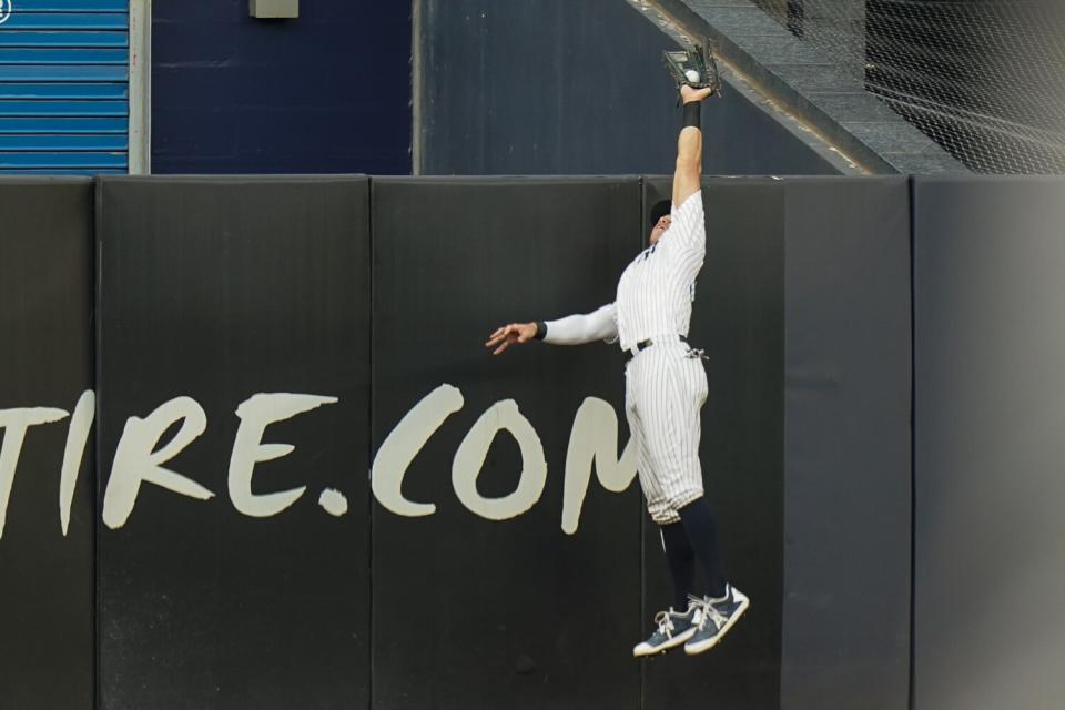 New York Yankees' Aaron Judge catches a ball hit by Angels' Shohei Ohtani for an out.