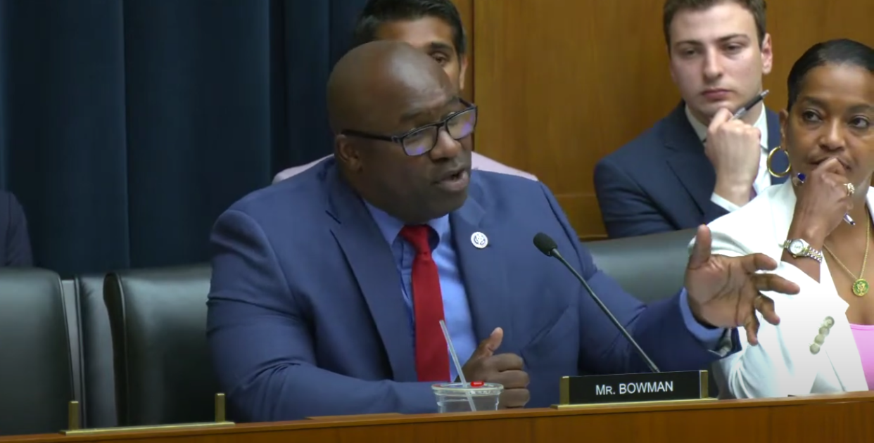 Representative Jamaal Bowman speaks into a microphone at a congressional hearing.