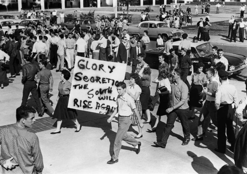 <span class="caption">School segregationists demonstrate in the streets of New Orleans on Nov. 21, 1960.</span> <span class="attribution"><a class="link " href="https://www.gettyimages.com/detail/news-photo/segregationists-demonstrate-in-the-streets-of-new-orleans-news-photo/1156197316?adppopup=true" rel="nofollow noopener" target="_blank" data-ylk="slk:AFP via Getty Images;elm:context_link;itc:0;sec:content-canvas">AFP via Getty Images</a></span>