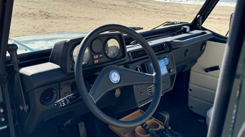 A view of the steering wheel and dash of a 1991 Mercedes-Benz 250GD restomod from Expedition Motor Company.
