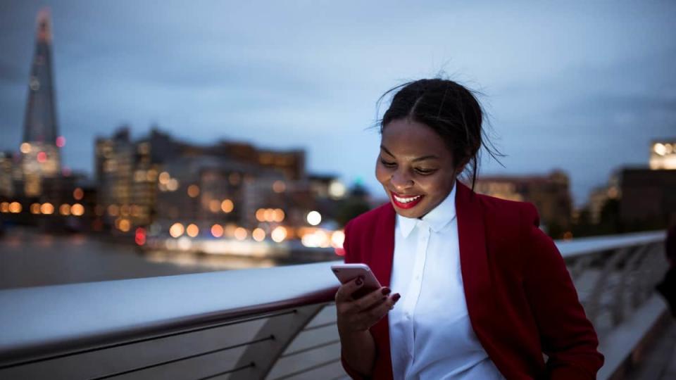 Front view photo of a woman using digital tablet in London