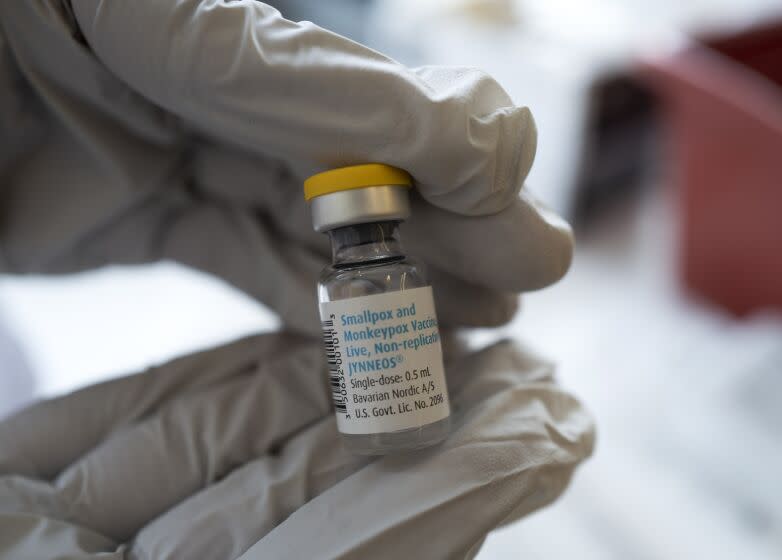 Registered pharmacist Sapana Patel holds a bottle of Monkeypox vaccine at a Pop-Up Monkeypox vaccination site on Wednesday, Aug. 3, 2022, in West Hollywood, Calif. With the arrival of additional JYNNEOS vaccination doses, the Los Angeles County Department of Public Health is expanding the criteria to include additional residents at high risk of exposure to monkeypox and launched a pop-up vaccination location in West Hollywood. (AP Photo/Richard Vogel)