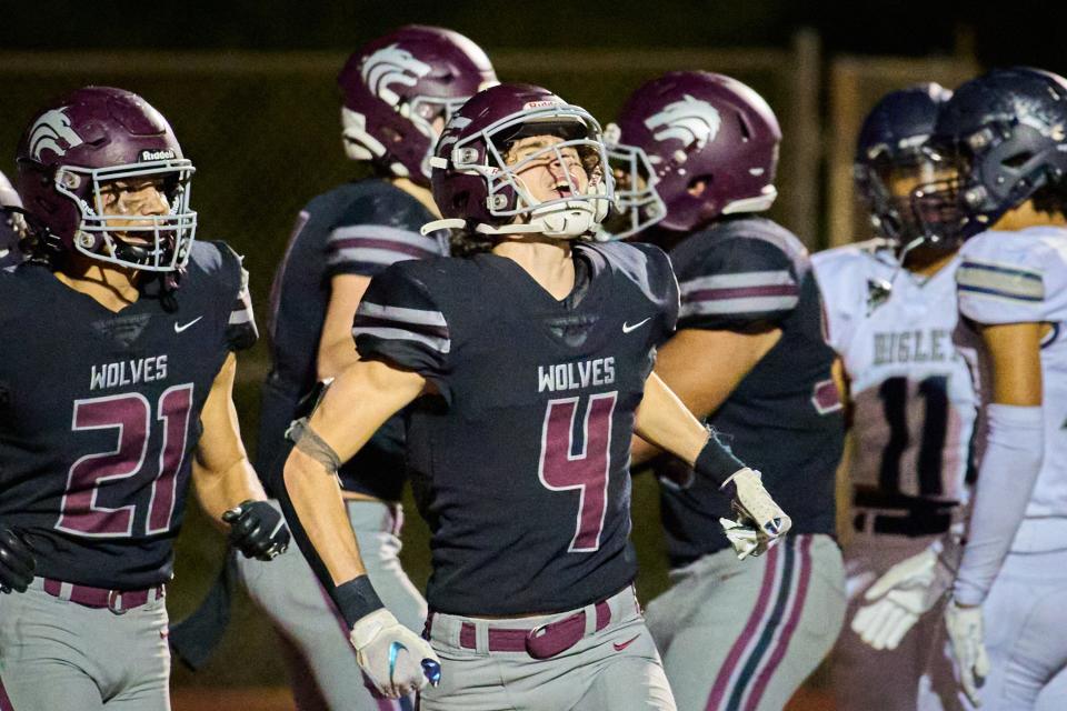 Desert Mountain Wolves wide receiver Jack Freeburg (4) celebrates after scoring a touchdown against the Higley Knights on Friday, Dec. 2, 2022, at Desert Mountain High School.