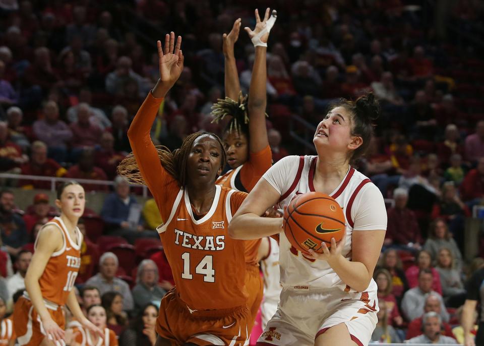 Iowa State's Izzi Zingaro works around Texas' Amina Muhammad for a shot last February in Ames. The season-ending injury to Rori Harmon might mean a shift in defensive philosophy for the Longhorns.