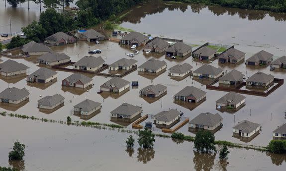 In this aerial photo over Hammond, La., flooded homes are seen off of LA-1064 .