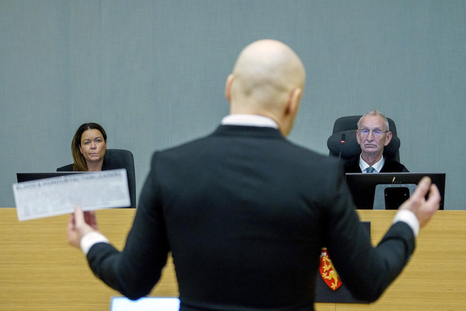 FILE - Co-judge Henriette Thoner, left, and judge Dag Bjoervik listen to convicted mass murderer Anders Behring Breivik, back to camera, on the first day of a hearing where he is seeking parole, in Skien, Norway, Jan. 18, 2022. A decade after the 2011 bombing and shooting spree that left 77 dead, Breivik is seeking early release from a 21-year sentence — the maximum term in Norway. (Ole Berg-Rusten/NTB scanpix via AP, File)