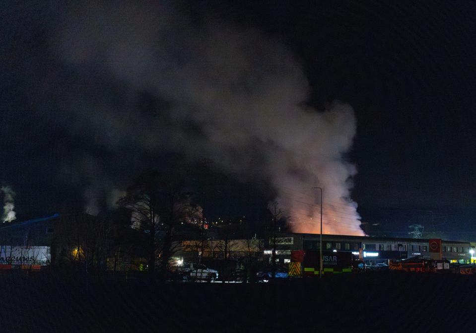 A large plume of smoke rises from a fire at the Treforest Industrial Estate in Pontypridd, Wales, Britain, 14 December 2023 (EPA)