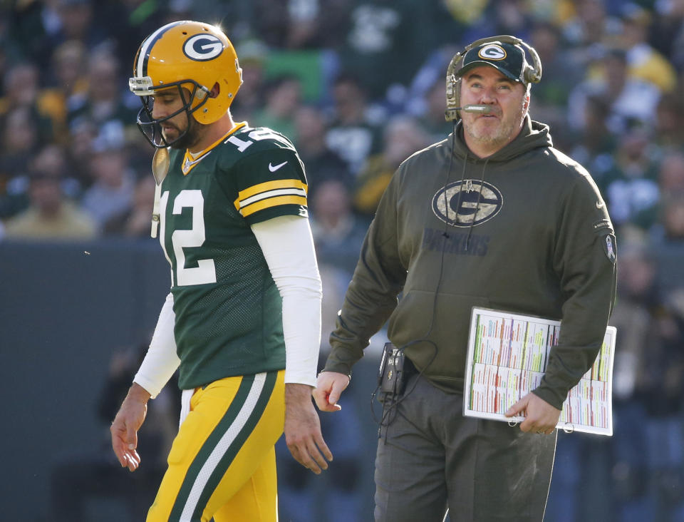 FILE - Green Bay Packers head coach Mike McCarthy talks to quarterback Aaron Rodgers during the first half of an NFL football game against the Detroit Lions Sunday, Nov. 15, 2015, in Green Bay, Wis. Rodgers won his lone Super Bowl title with Mike McCarthy as his coach before their relationship eventually soured. (AP Photo/Mike Roemer, File)