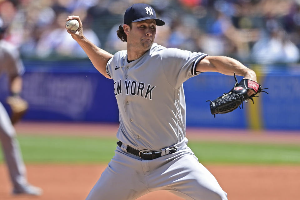 New York Yankees starting pitcher Gerrit Cole delivers in the first inning in the first baseball game of a doubleheader against the Cleveland Guardians, Saturday, July 1, 2022, in Cleveland. (AP Photo/David Dermer)