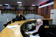 People work at Khartoum Stock Exchange in Khartoum