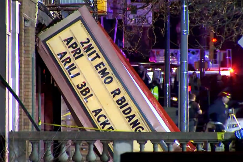 Emergency responders work near a collapsed theatre in Belvidere, Ill., on Friday.  (WMAQ)