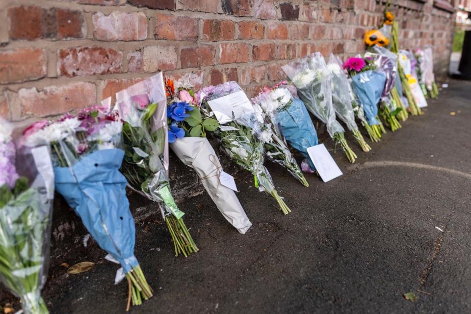 PHOTO: Floral tributes near the scene in Hart Street, Southport, Britain, Tuesday July 30, 2024, where two children died and nine were injured in a 'ferocious' knife attack, police said.  (James Speakman/AP)