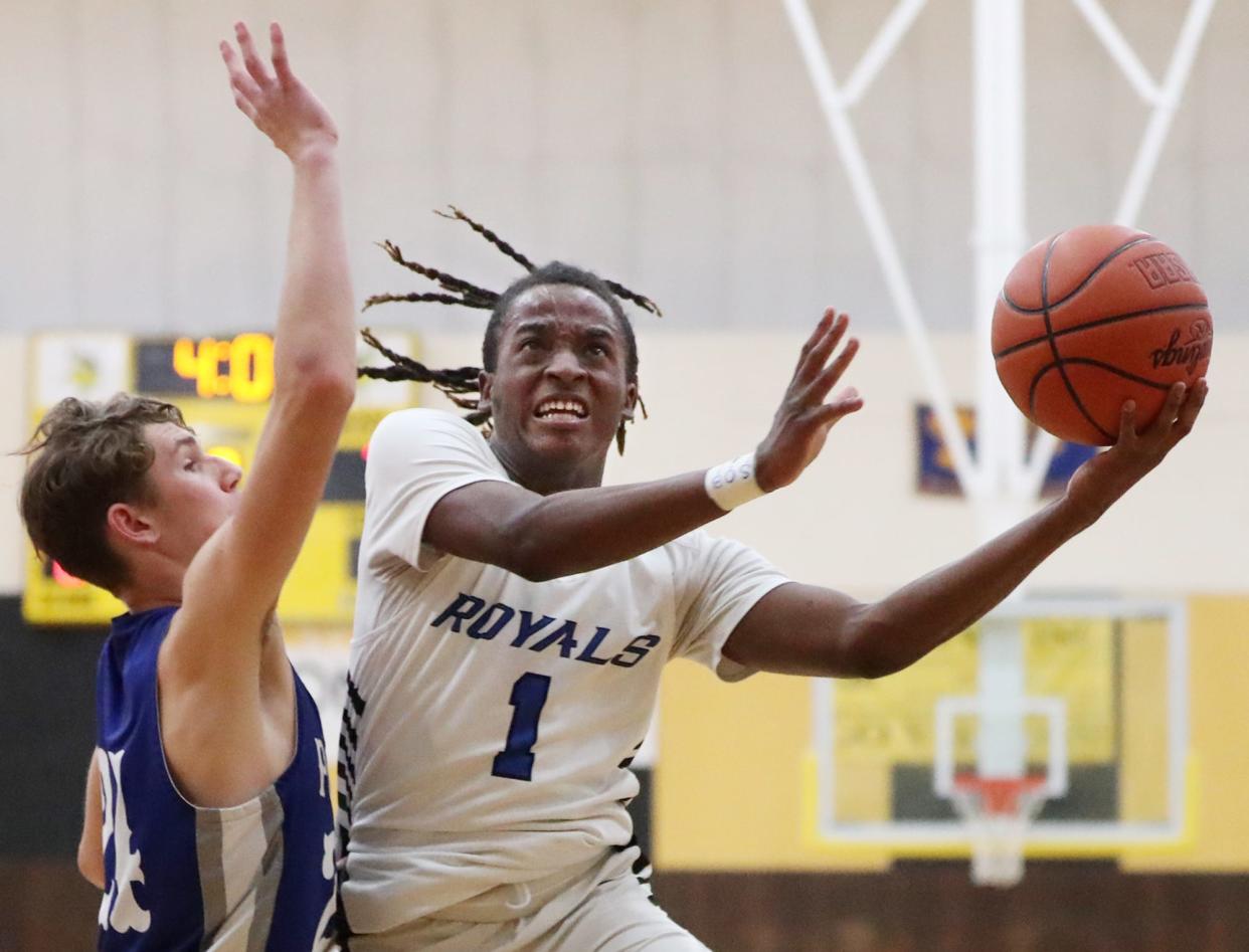 CVCA's LaVelle Sharpe Jr. goes to the basket under pressure from a Poland defender in an OHSAA Division II district semifinal at North High School, Wednesday, March 6, 2024.