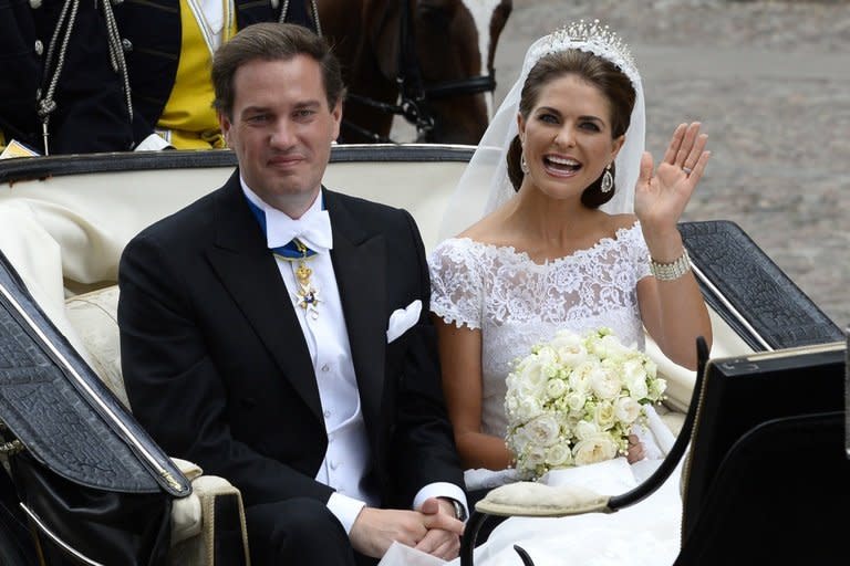 The newly wed Princess Madeleine of Sweden and New York businessman Christopher O´Neill leave in a carriage in Stockholm on June 8, 2013