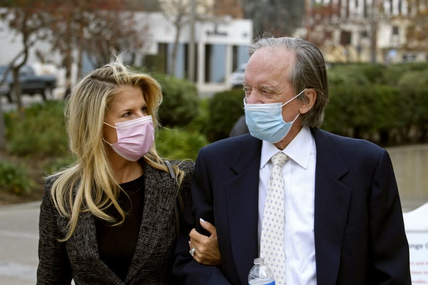 Bill Gross and partner Amy Schwartz arrive for a court hearing in Santa Ana, California, December 7, 2020.