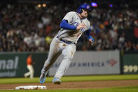 Chicago Cubs' Ian Happ rounds third on the way to scoring against the San Francisco Giants during the seventh inning of a baseball game in San Francisco, Friday, June 9, 2023. (AP Photo/Jeff Chiu)