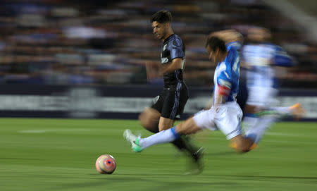 Football Soccer- Leganes v Real Madrid - Spanish La Liga Santander - Butarque Stadium, Leganes, Spain - 05/04/17 Real Madrid's Marco Asensio (L) and Leganes' Martin Mantovani in action. REUTERS/Sergio Perez