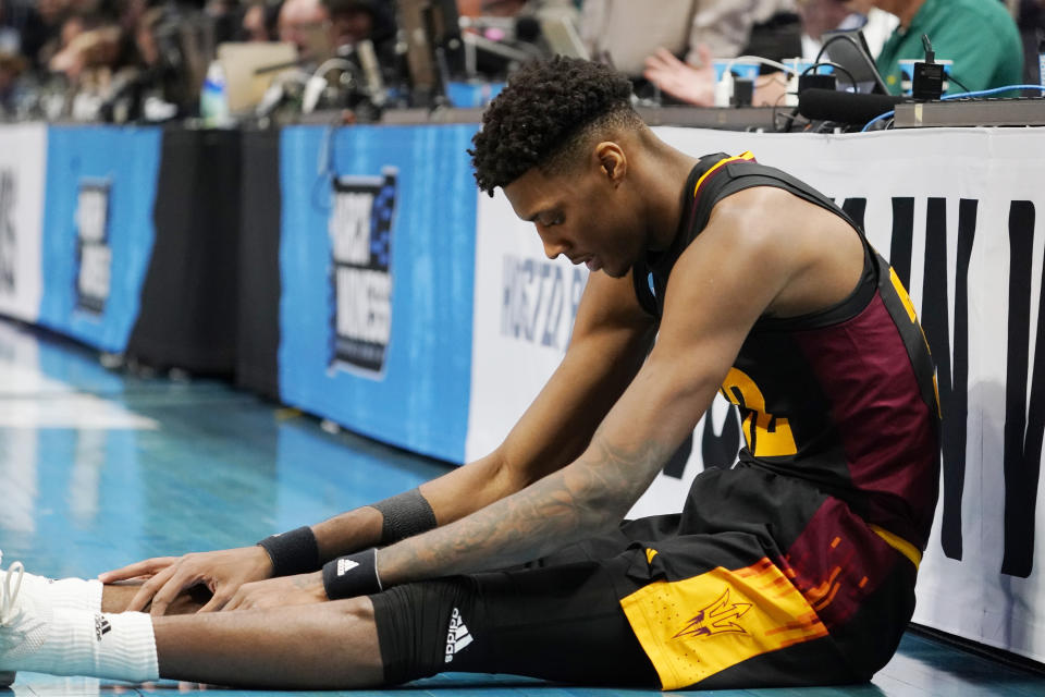 Arizona State forward Alonzo Gaffney sits on the court after the team's first-round college basketball game against TCU in the men's NCAA Tournament on Friday, March 17, 2023, in Denver. (AP Photo/John Leyba)