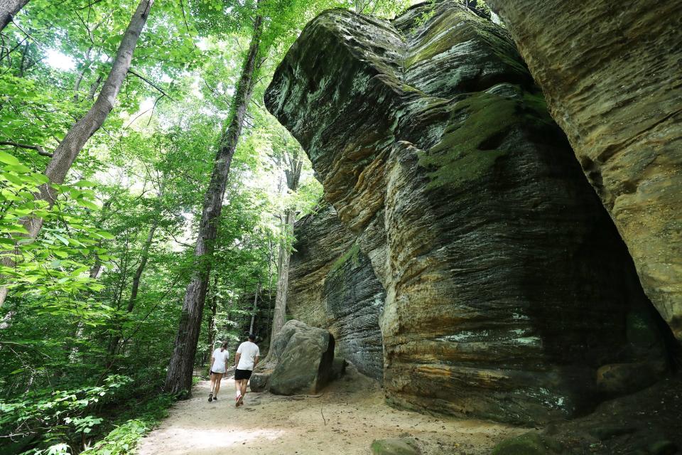 A couple walks along the Ledges Trail in Cuyahoga Valley National Park.