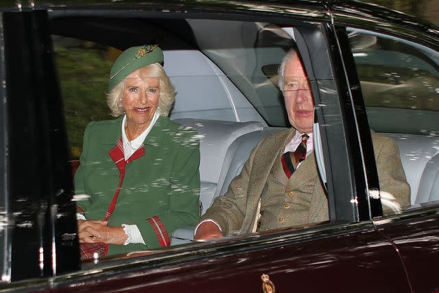 <p>Peter Jolly Northpix/Shutterstock </p> King Charles and Queen Camilla drive to Craithe Kirk near Balmoral Castle.