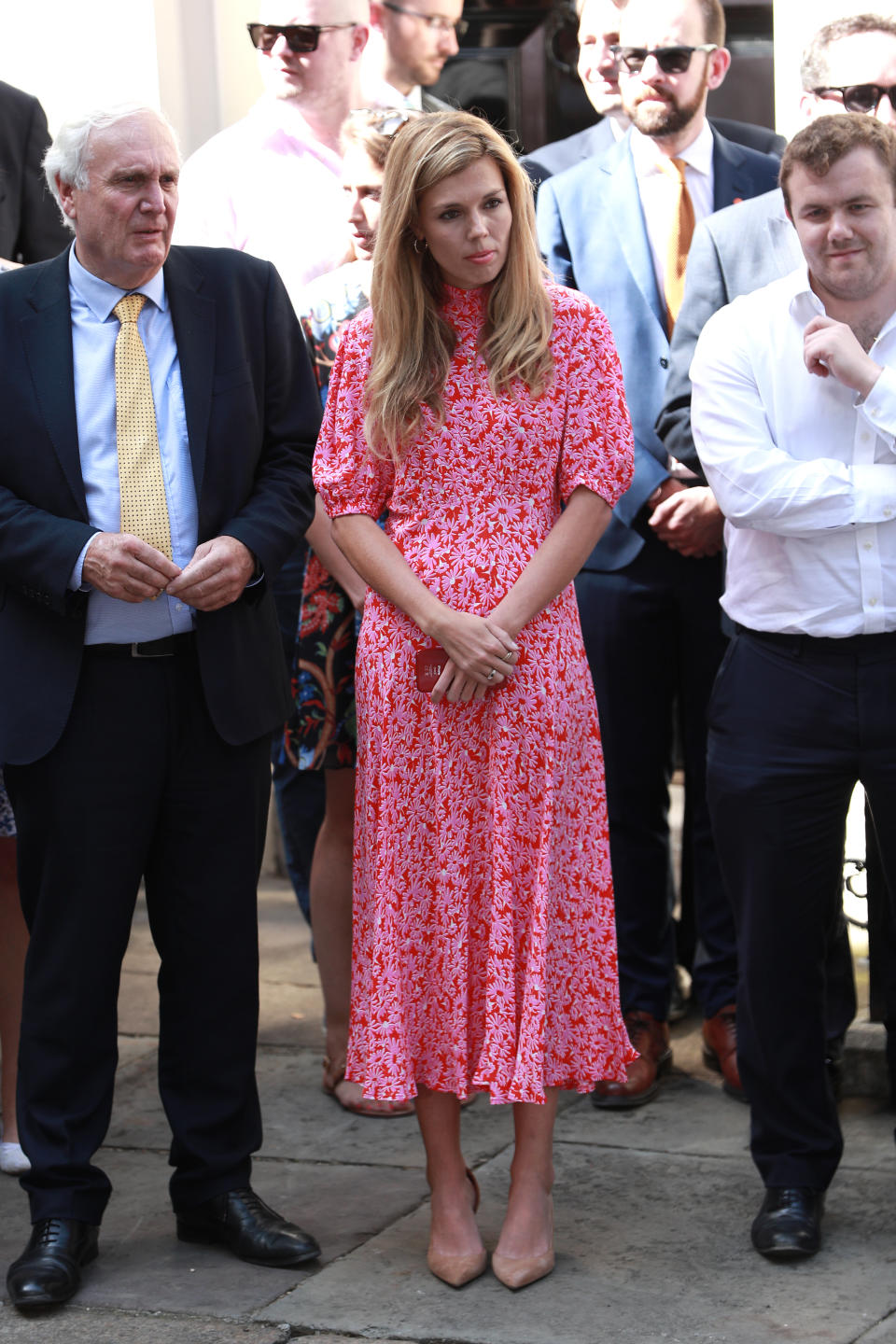 Carrie opted for a bright pink and red floral midi dress from British label Ghost for her debut appearance at No.10 earlier this summer [Photo: Getty Images]