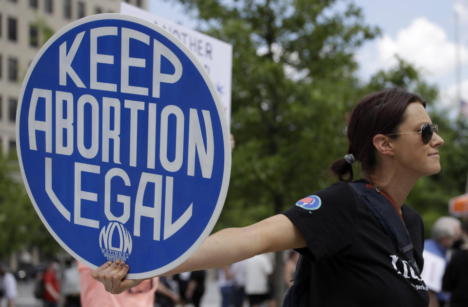 FILE - An abortion-rights demonstrator holds a sign during a rally, May 14, 2022, in Chattanooga, Tenn. On Wednesday, April 10, 2024, Republican lawmakers in Tennessee advanced legislation making it illegal for adults to help minors get an abortion without parental consent. (AP Photo/Ben Margot, File)