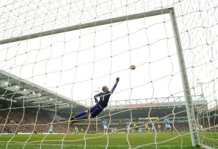 Norwich City's Patrick Bamford hits the crossbar as Manchester City's Joe Hart looks on. Norwich City v Manchester City - Barclays Premier League - Carrow Road - 12/3/16. Action Images via Reuters / Tony O'Brien Livepic