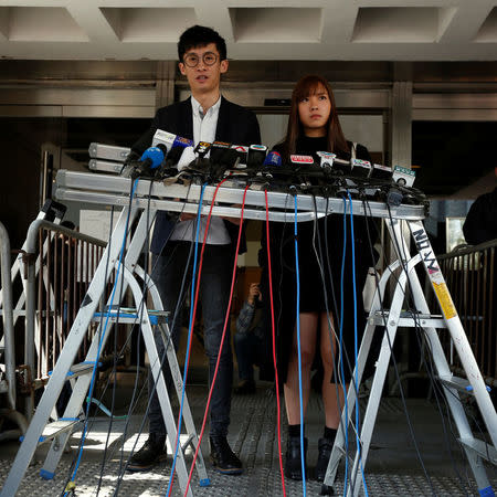 Pro-independence activists Yau Wai-Ching (R) and Baggio Leung meet journalists outside High Court after they lost an appeal against their disqualification as lawmakers in Hong Kong, China November 30, 2016. REUTERS/Bobby Yip