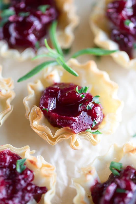 <p>Peas and Crayons</p><p>Cranberry brie phyllo cups are always a hit! This easy yet elegant appetizer features crisp phyllo shells filled with creamy brie cheese and warm cranberry sauce.</p><p><strong>Get the recipe: <a href="https://peasandcrayons.com/2019/12/cranberry-brie-phyllo-cups.html" rel="nofollow noopener" target="_blank" data-ylk="slk:Cranberry Brie Phyllo Cups;elm:context_link;itc:0;sec:content-canvas" class="link rapid-noclick-resp"><em>Cranberry Brie Phyllo Cups</em></a></strong></p>