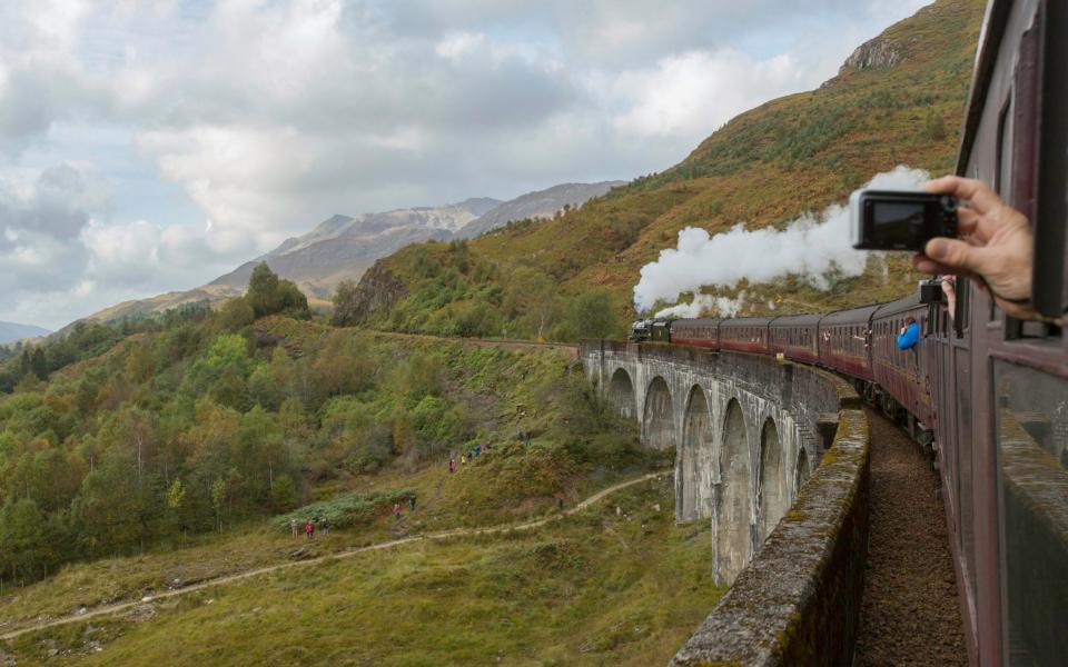 The Jacobite Steam Train making its way along the Glenfinnan Viaduct on the West Highland Line, in Lochaber, Scotland - Credit: PA