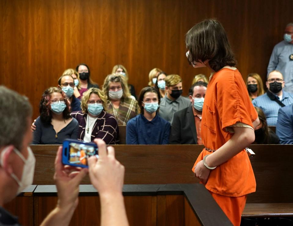 Oxford High School shooting suspect Ethan Crumbley leaves the courtroom past victims, their family members and community members after he pleaded guilty for his role in the school shooting that occurred on Nov. 30, 2021.