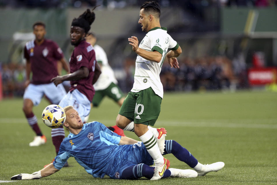 Timbers midfielder Sebastian Blanco (10) has his shot blocked by Colorado Rapids goalkeeper William Yarbrough during an MLS soccer match Wednesday, Sept. 15, 2021, in Portland, Ore. (Sean Meagher/The Oregonian via AP)