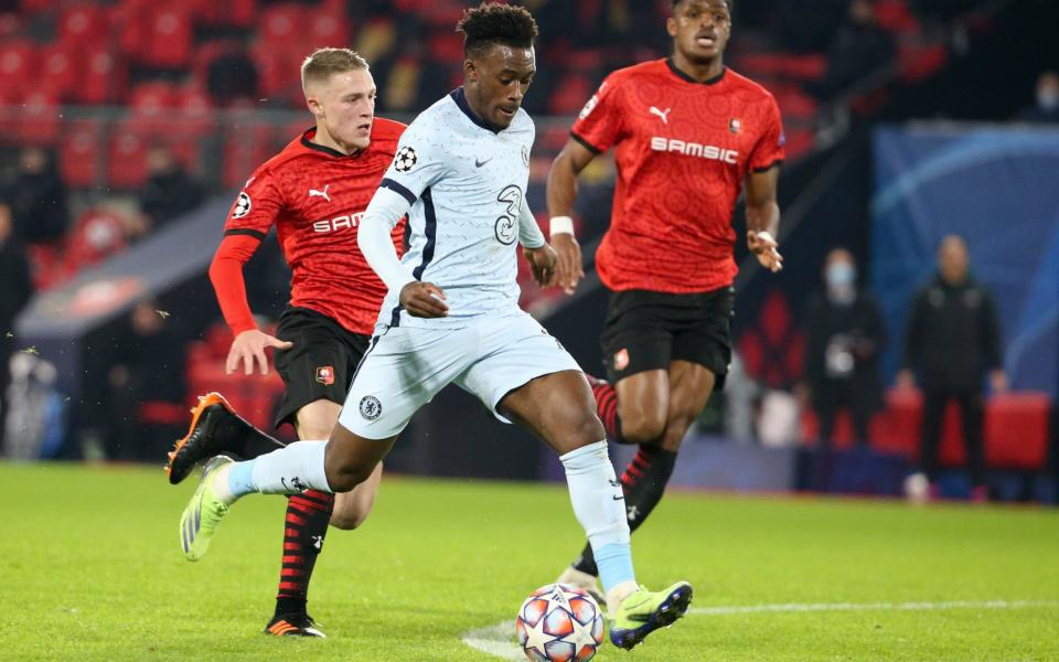 Callum Hudson-Odoi of Chelsea scores his goal despite Adrien Truffert of Stade Rennais (left) during the UEFA Champions League Group E stage match between Stade Rennais and Chelsea FC  - Getty Images